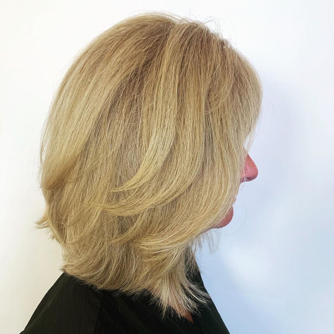 feathered long bob hairstyle for women over 50
